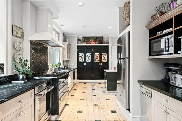 a living room with furniture and a book shelf