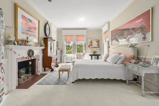 a spacious bedroom with a bed and a couch