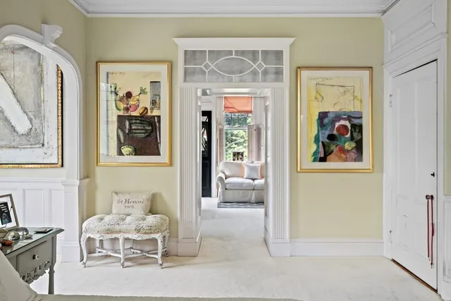 a living room with furniture and a closet