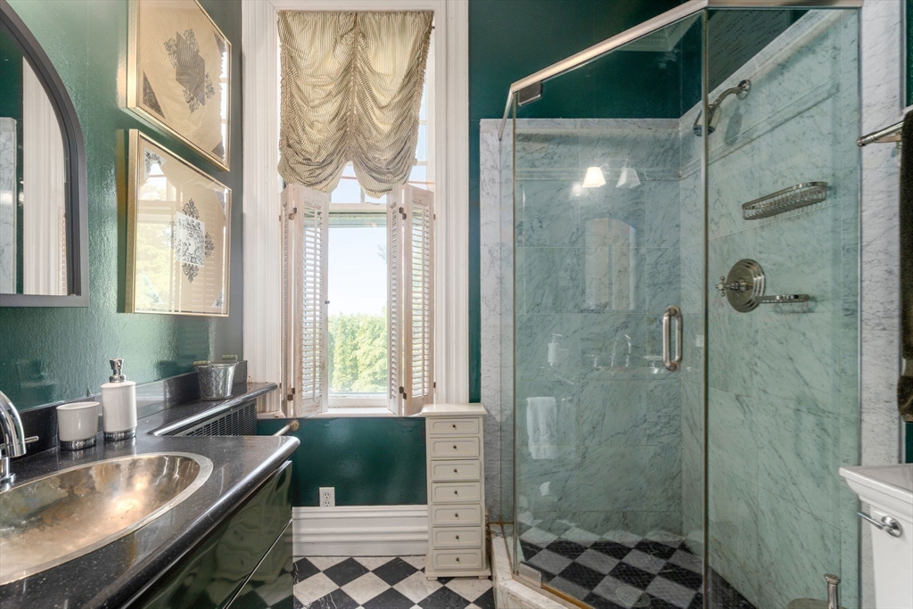 51 Cliff Street Nahant, MA 01908 - Photo 22 of 42 a bathroom with a granite countertop sink a toilet and shower