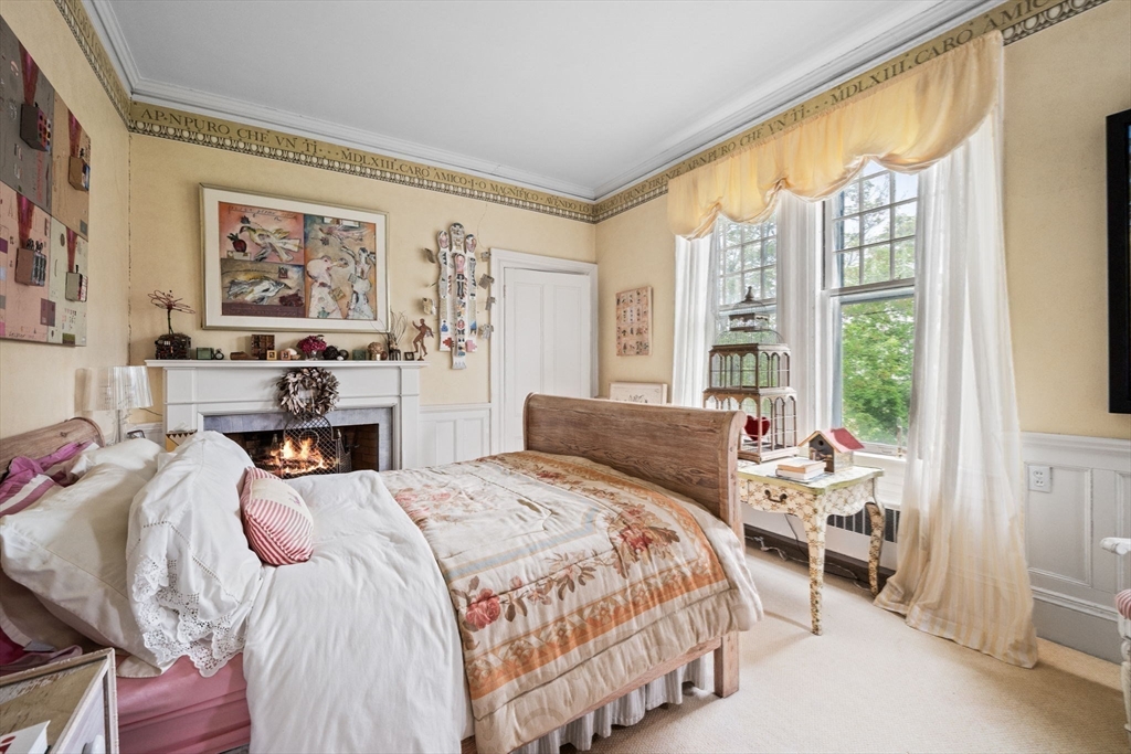 51 Cliff Street Nahant, MA 01908 - Photo 23 of 42 a bedroom with a bed and a large window with the outer view