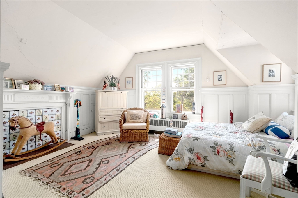 51 Cliff Street Nahant, MA 01908 - Photo 25 of 42 a bedroom with bed and glass door