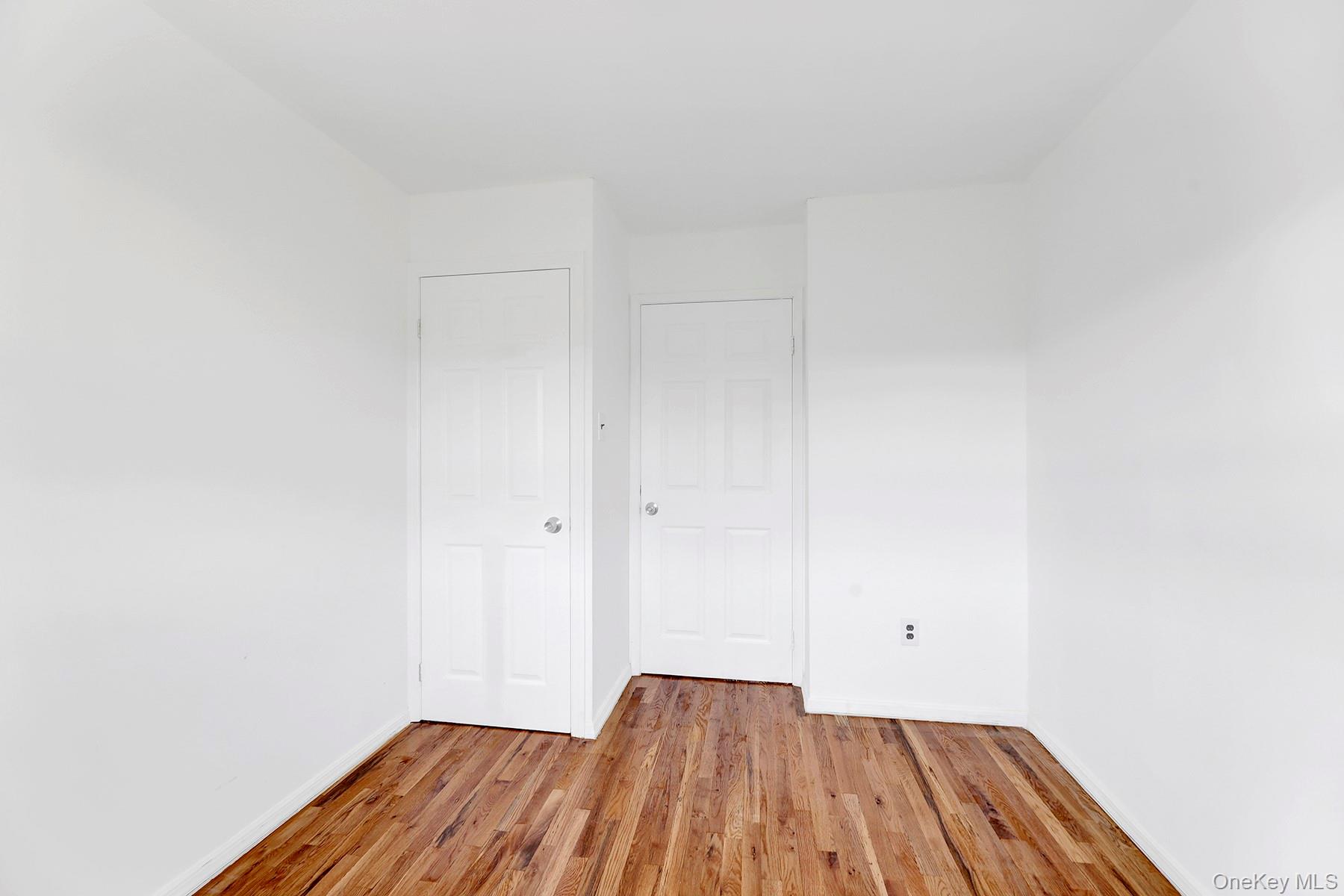559 Cleveland Street Brooklyn, NY 11208 - Photo 19 of 34 Unfurnished bedroom with wood finished floors and baseboards