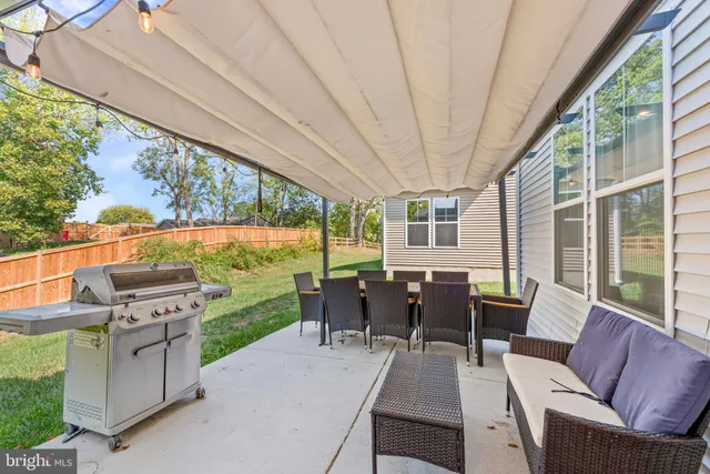 a dining room with furniture and garden view
