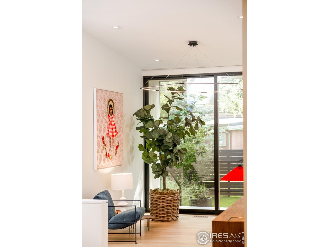 3355 Vista Drive Boulder, CO 80304 - Photo 17 of 40 a vase of flowers sitting on a floor in front of a window