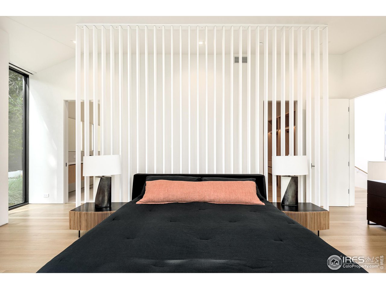 3355 Vista Drive Boulder, CO 80304 - Photo 21 of 40 a bedroom with a bed and a large mirror