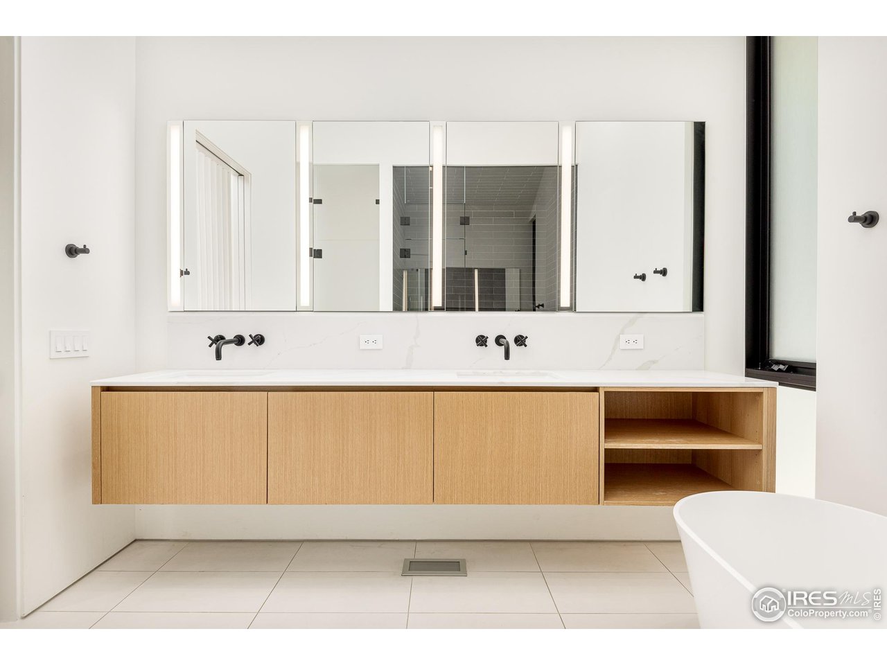3355 Vista Drive Boulder, CO 80304 - Photo 23 of 40 a bathroom with a sink a toilet and mirror