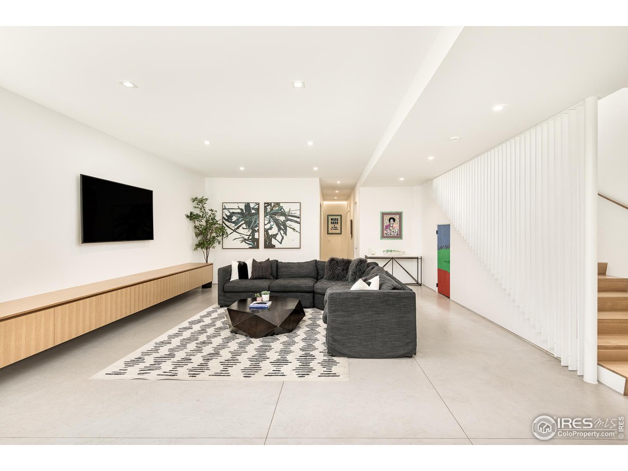 3355 Vista Drive Boulder, CO 80304 - Photo 31 of 40 a living room with furniture and a flat screen tv