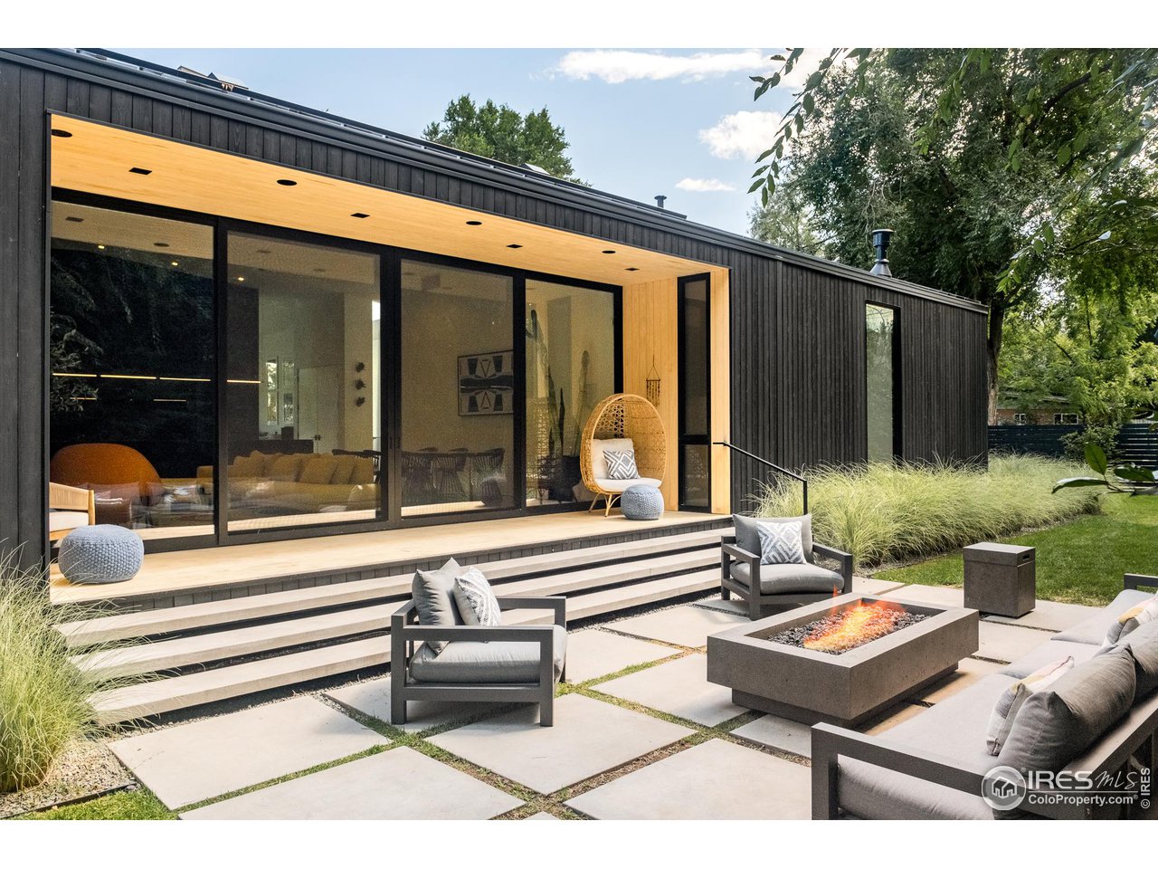 3355 Vista Drive Boulder, CO 80304 - Photo 38 of 40 a backyard of a house with basket ball court tables and chairs