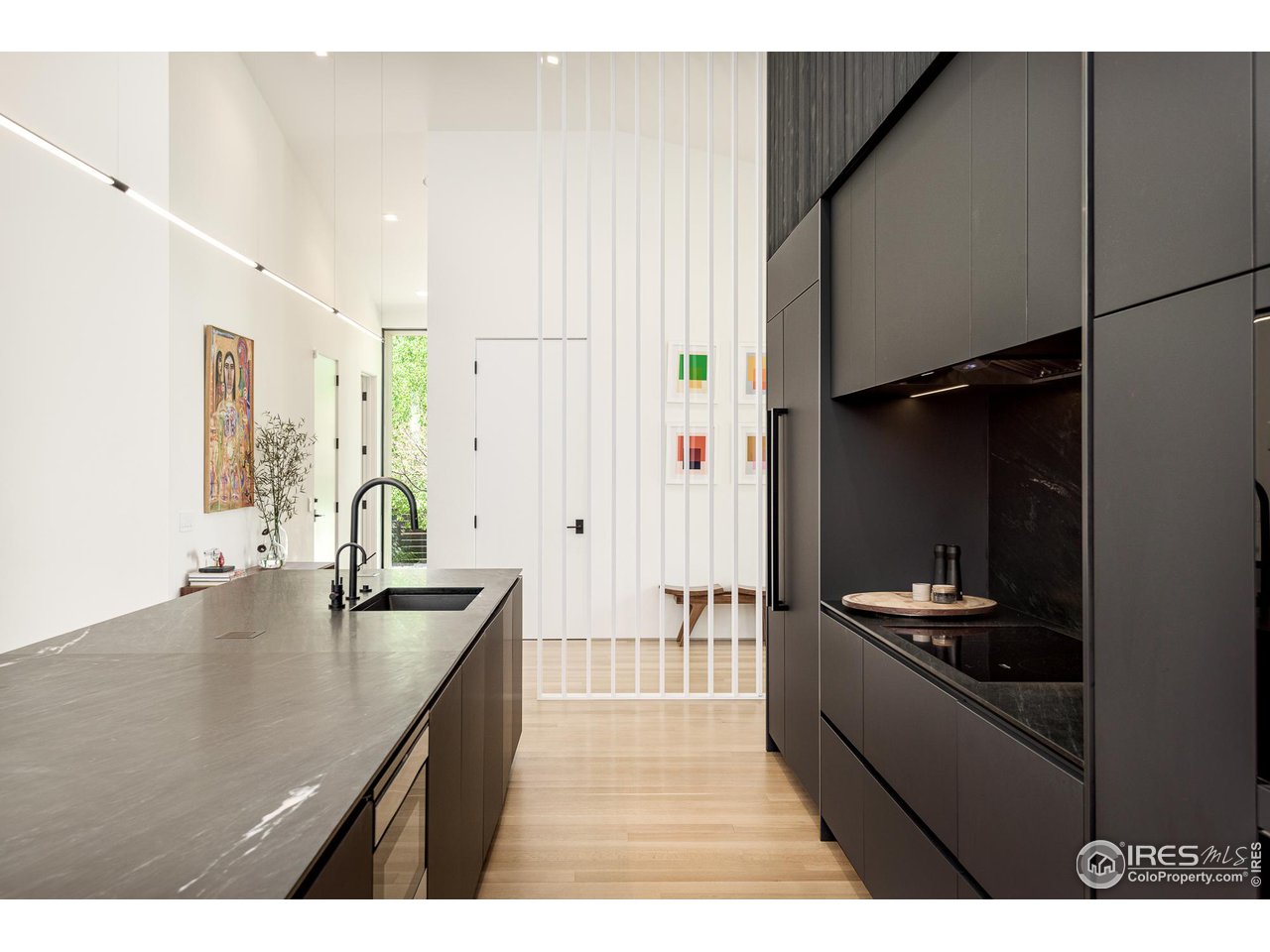 3355 Vista Drive Boulder, CO 80304 - Photo 6 of 40 a kitchen with granite countertop a sink stainless steel appliances and cabinets