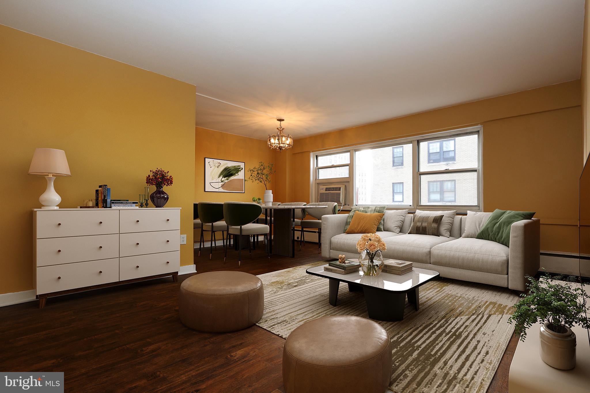 118 South 21st Street, Unit 1308 Philadelphia, PA 19103 - Photo 2 of 15 a living room with furniture and windows