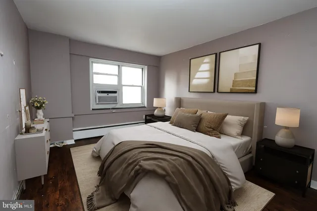 a bedroom with bed and window