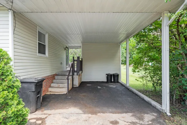 a balcony with wooden floor and fence