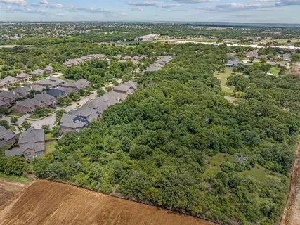 a view of a field with an ocean view
