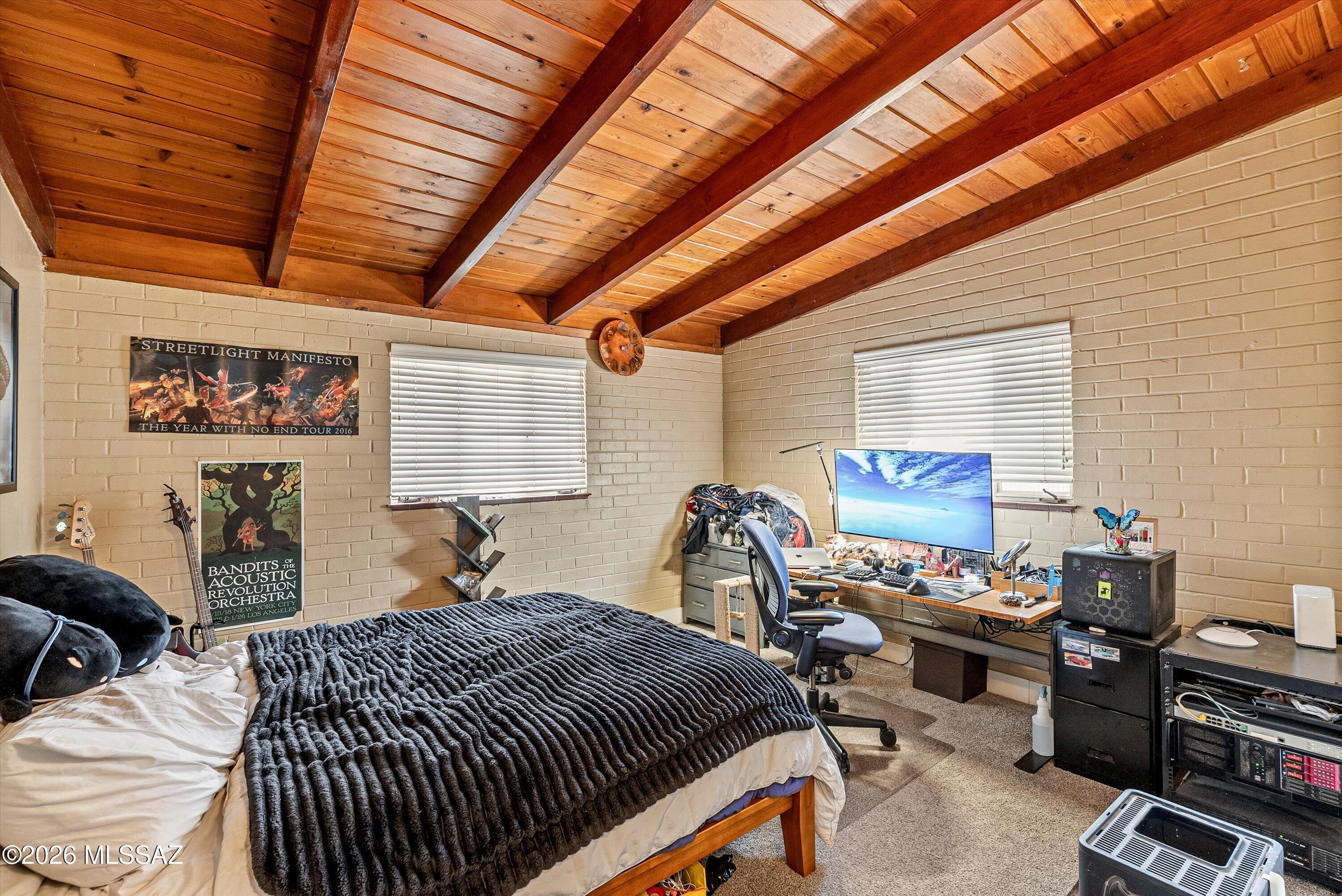 2934 East Exeter Street Tucson, AZ 85716 - Photo 11 of 20 a bed room with a bed and a chair