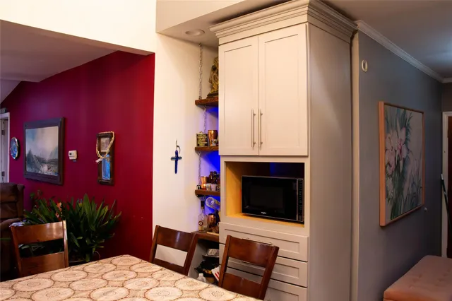 a bedroom with a bed dresser and a window