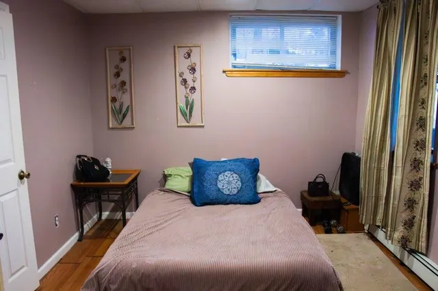 a bathroom with a granite countertop shower and a sink