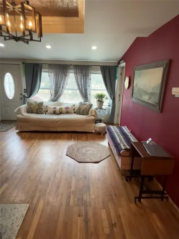 a living room with hardwood floor
