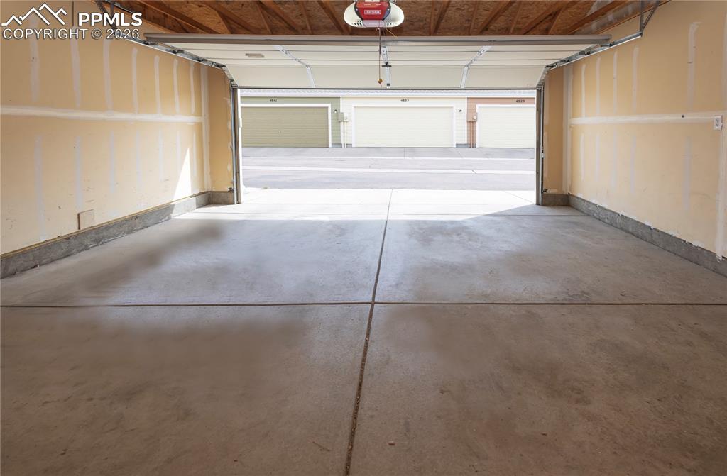 4815 Harrier Ridge Drive Colorado Springs, CO 80916 - Photo 20 of 33 Garage featuring a garage door opener