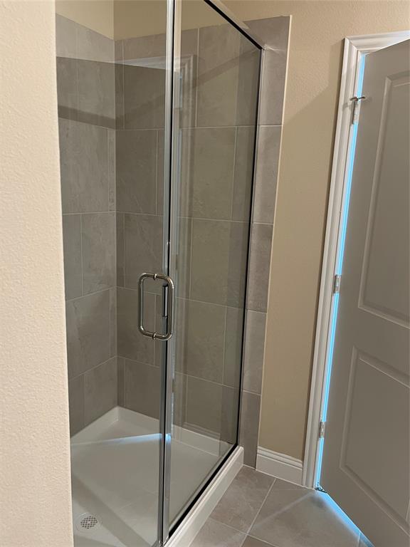 1013 Amendun Lane Anna, TX 75409 - Photo 11 of 19 a bathroom with a glass shower door