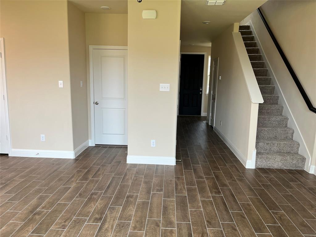 1013 Amendun Lane Anna, TX 75409 - Photo 19 of 19 a view of a hallway with wooden floor and staircase