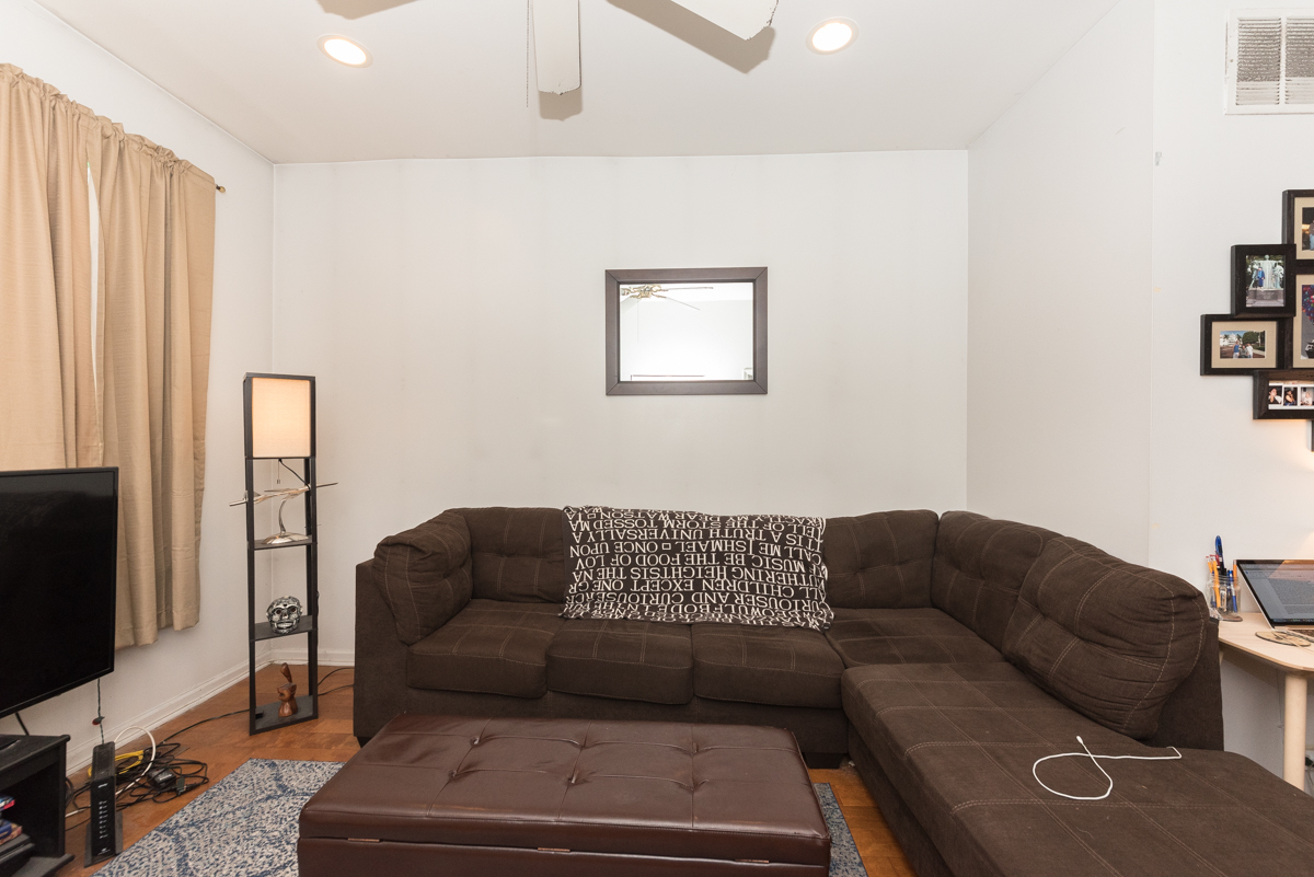 2139 West Huron Street, Unit 1F Chicago, IL 60612 - Photo 4 of 12 a living room with furniture and a flat screen tv