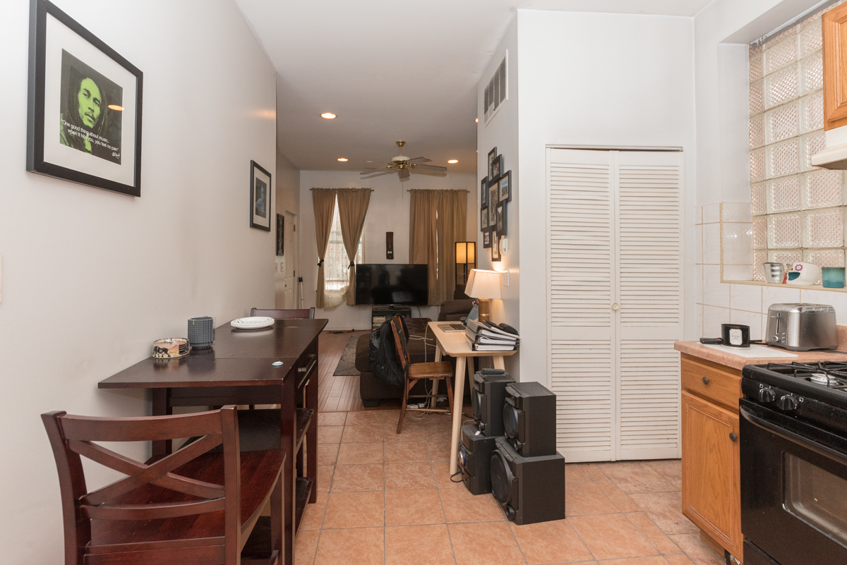 2139 West Huron Street, Unit 1F Chicago, IL 60612 - Photo 5 of 12 a dining room with furniture and window