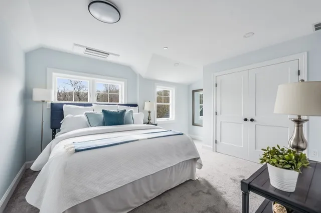 a bed room with a bed and a table