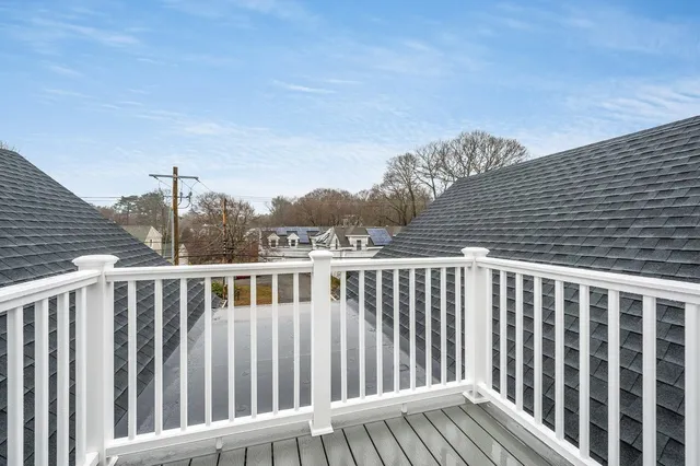 a view of a wooden roof deck