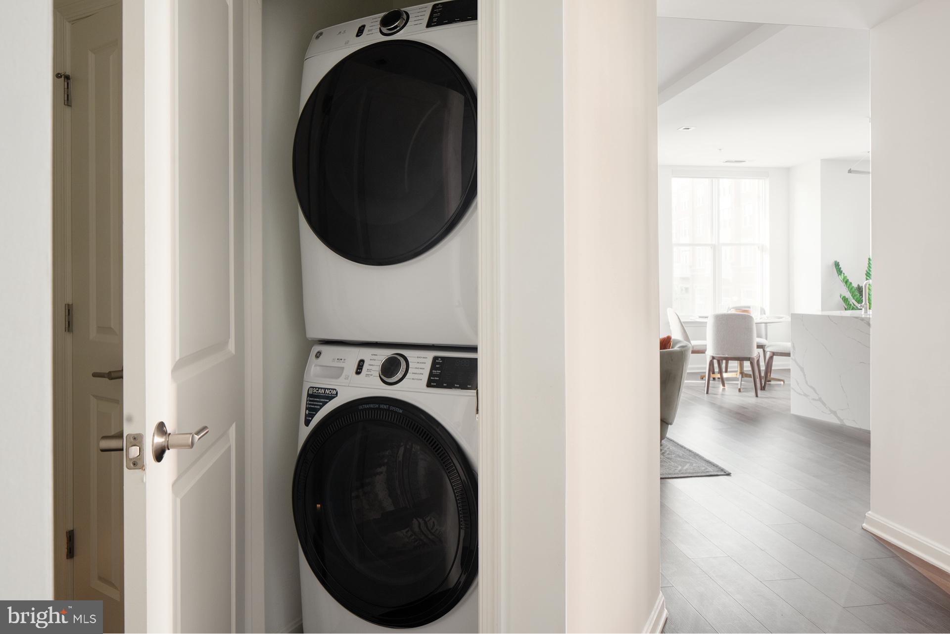 3820 Chaplin Place, Unit 1104/CLAUDE Chevy Chase, MD 20815 - Photo 20 of 26 a view of a hallway with washer and dryer