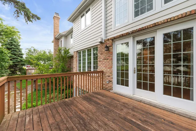 a view of a deck with wooden floor and fence