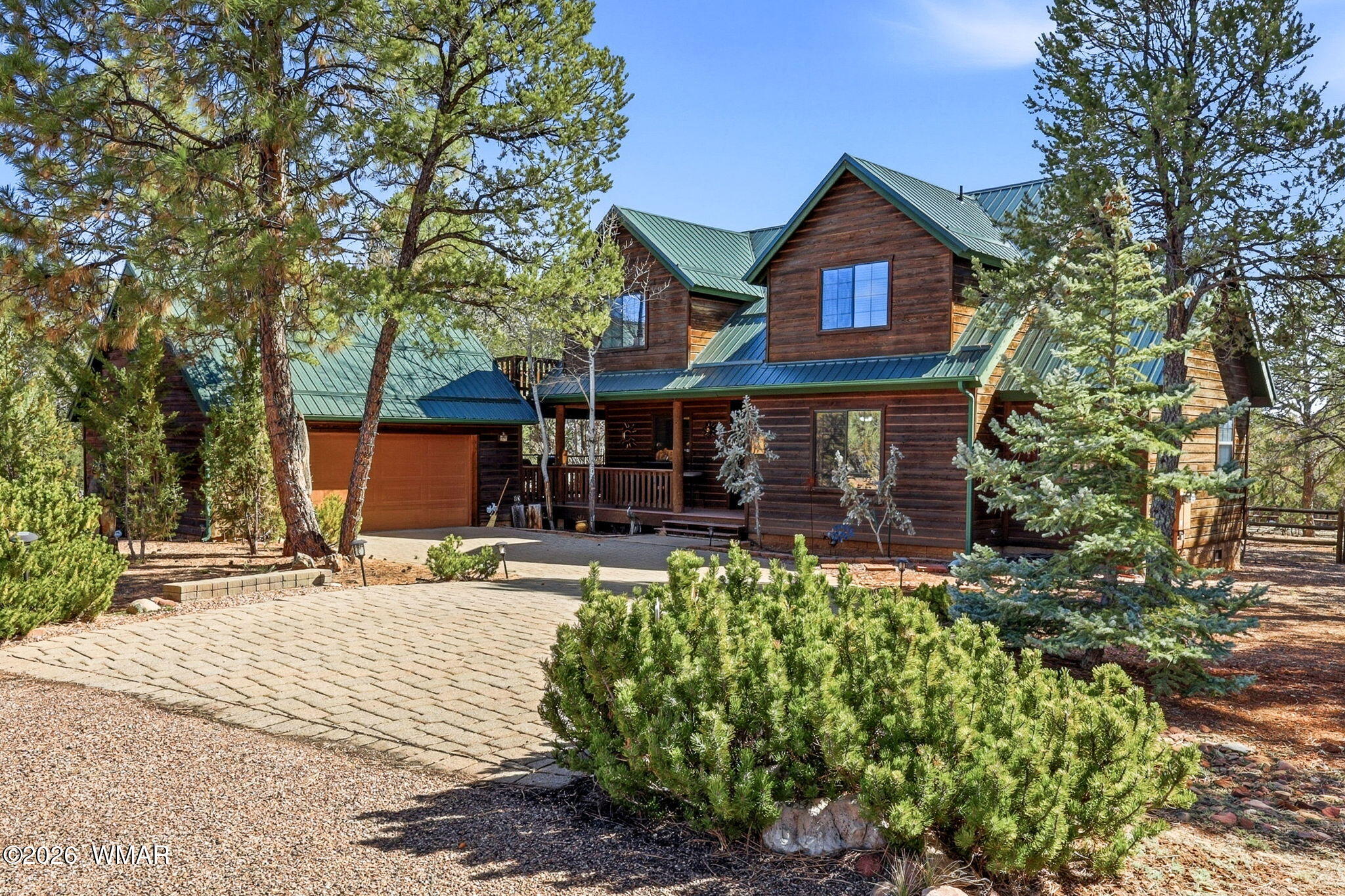 2337 Puma Circle Overgaard, AZ 85933 - Photo 1 of 35 a front view of a house with garden