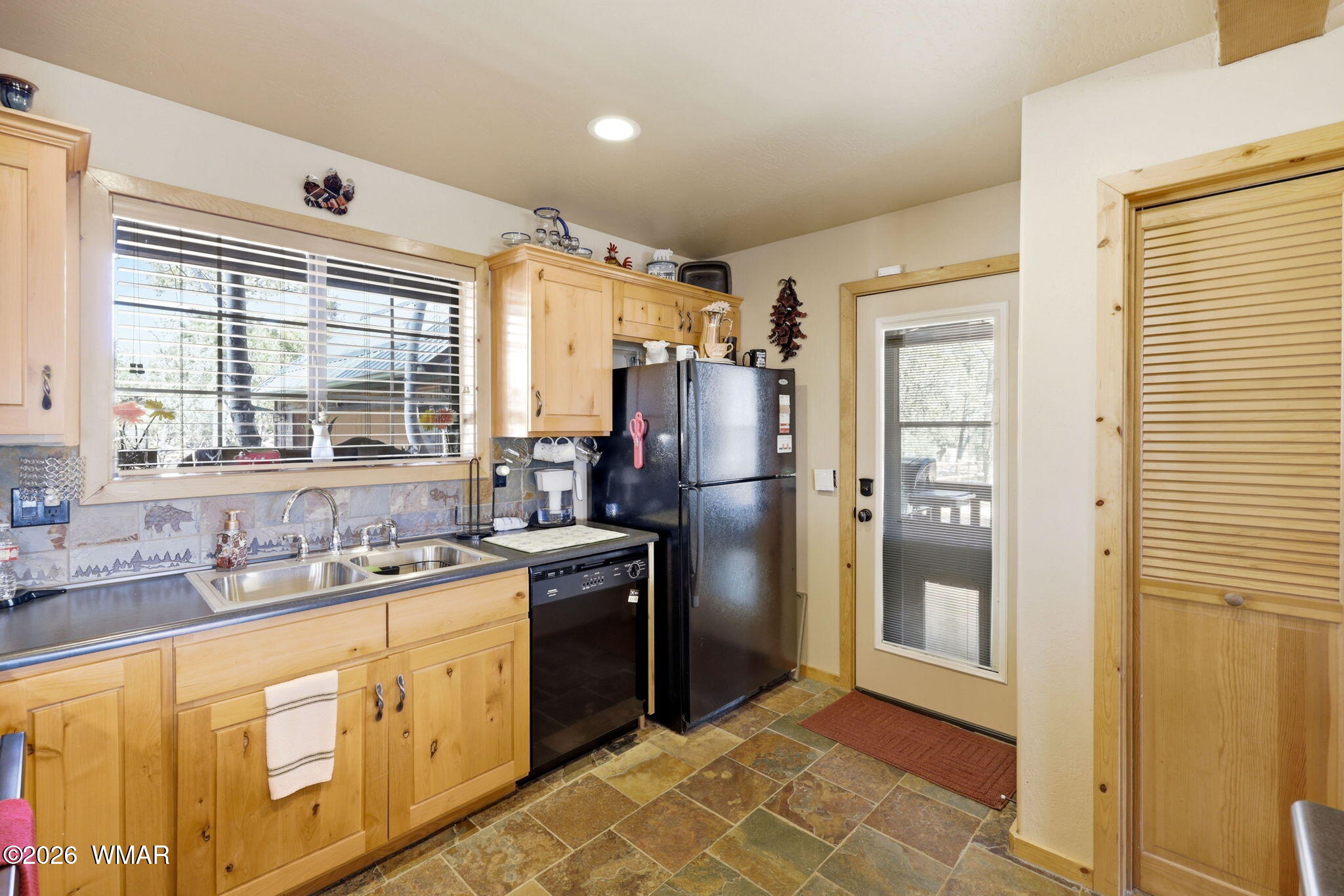 2337 Puma Circle Overgaard, AZ 85933 - Photo 13 of 35 a kitchen with stainless steel appliances granite countertop a refrigerator and a sink