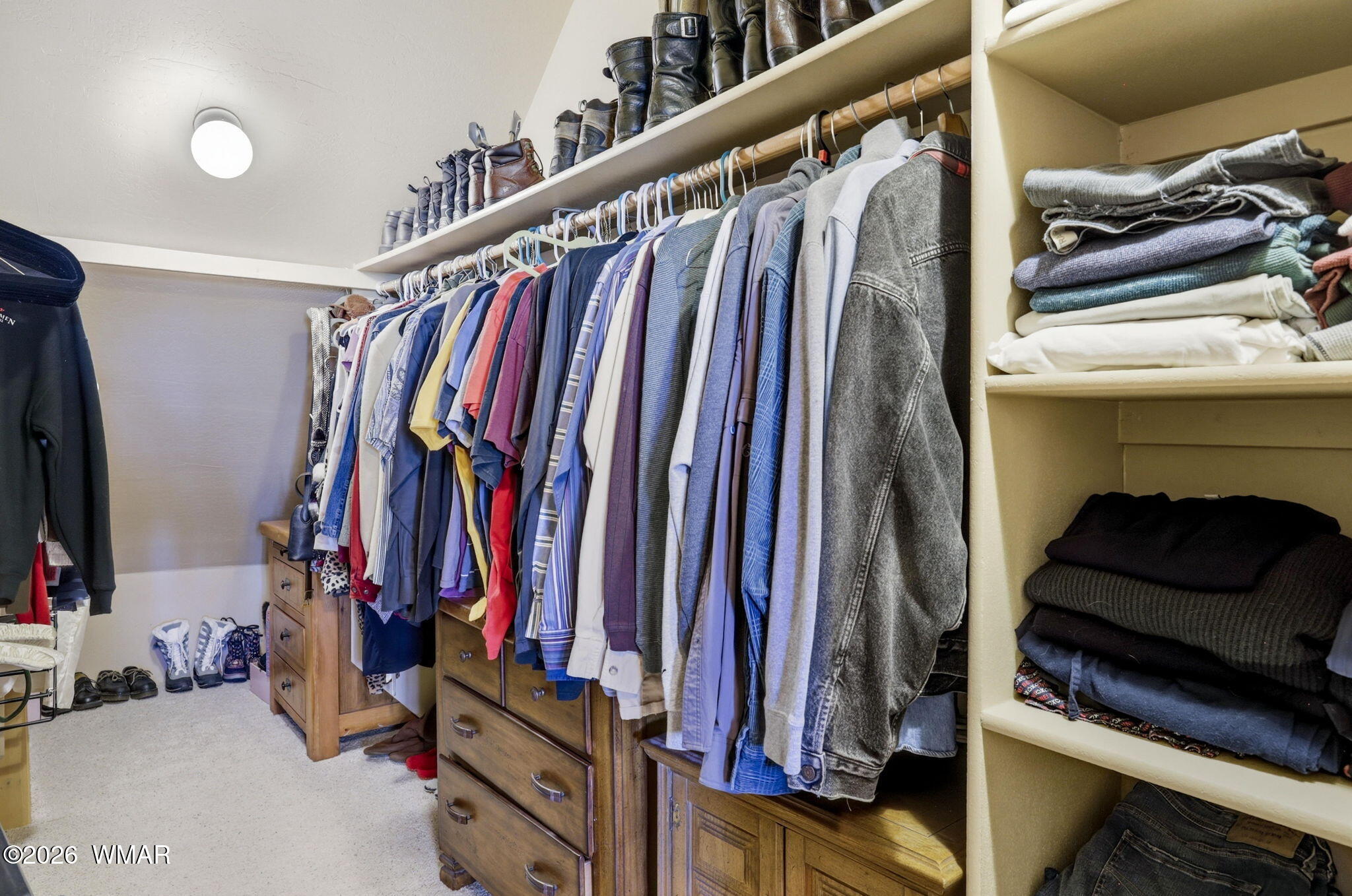 2337 Puma Circle Overgaard, AZ 85933 - Photo 24 of 35 a view of walk in closet with clothes and shoes