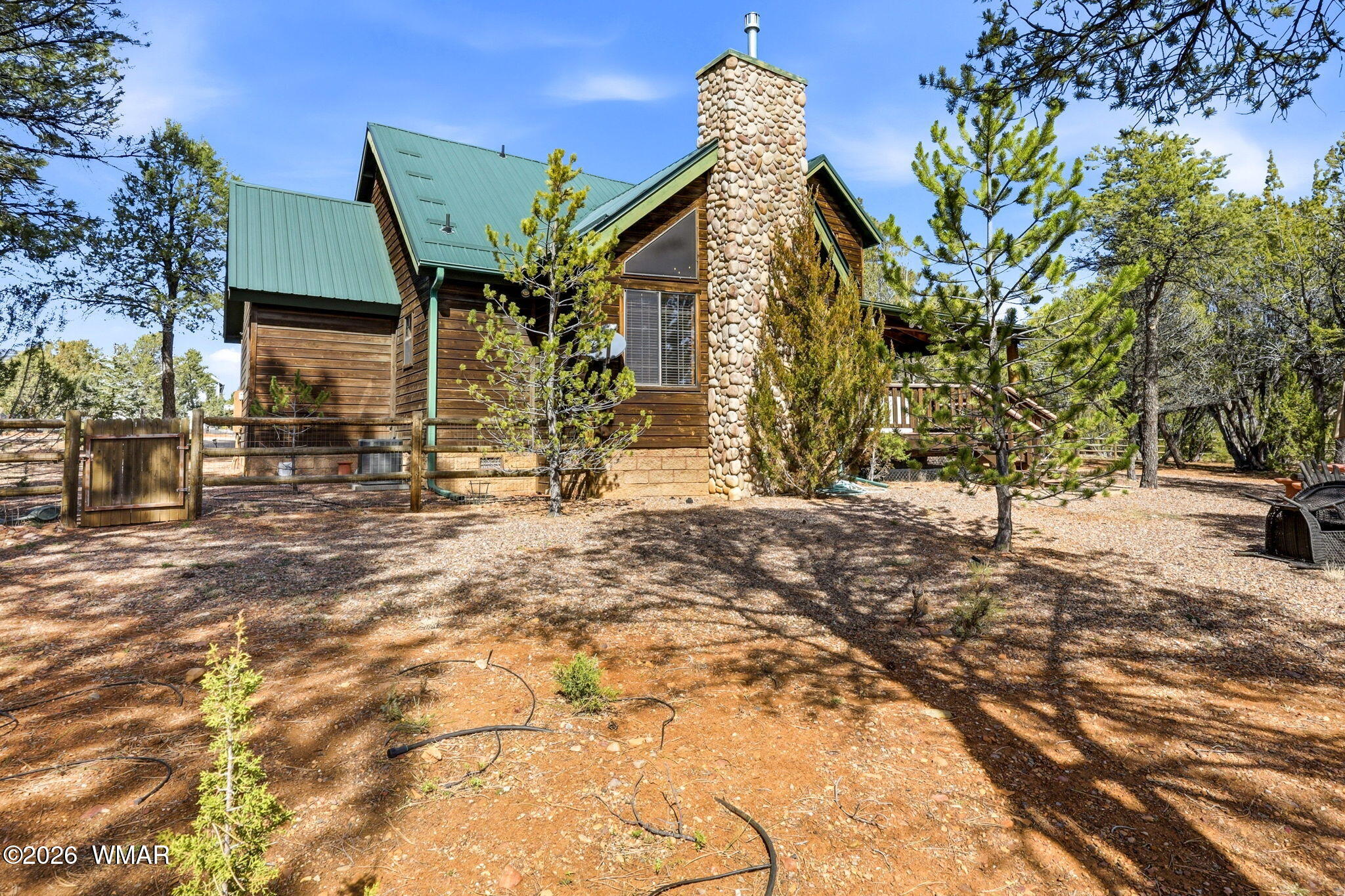 2337 Puma Circle Overgaard, AZ 85933 - Photo 32 of 35 a view of a house with large trees