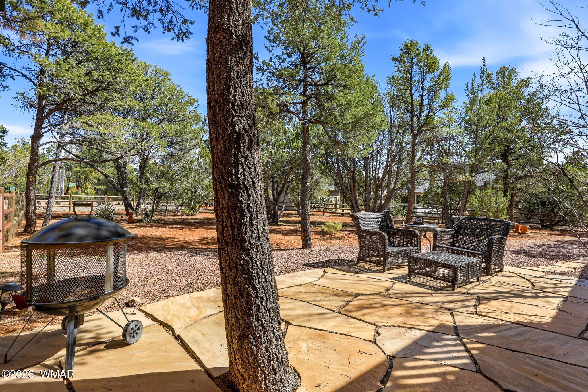 2337 Puma Circle Overgaard, AZ 85933 - Photo 35 of 35 a view of a patio with table and chairs under an umbrella