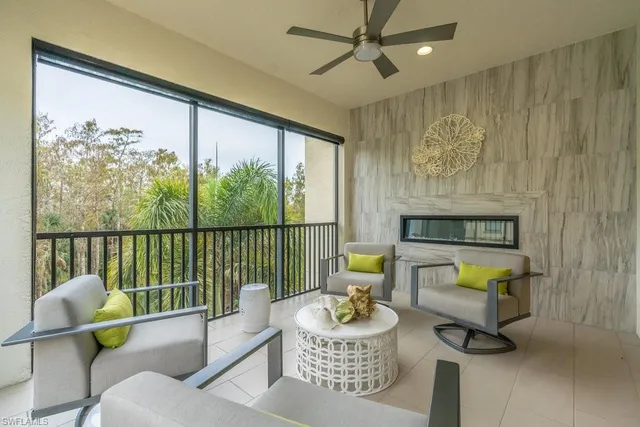 a view of swimming pool with outdoor seating and a patio