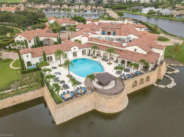 a large white building with a view of the patio