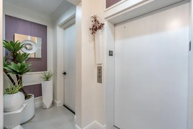a view of a hallway and interior of a house