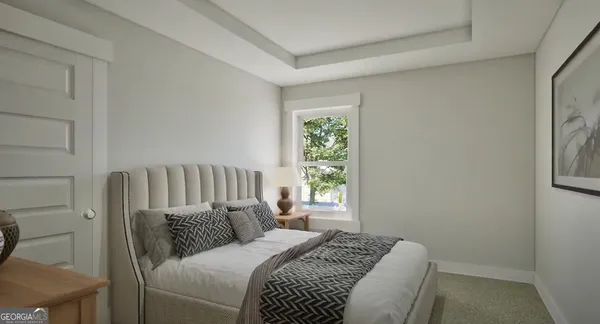 a bed sitting in a bedroom next to a window