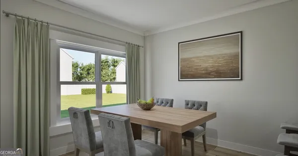 a view of a dining room with furniture window and outside view