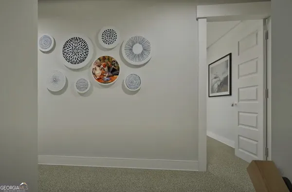 a view of storage and utility room with fridge