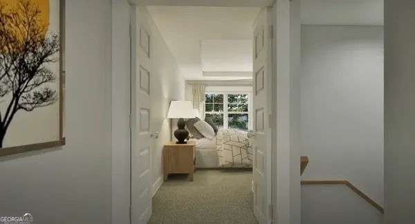 a view of a bedroom with a bed and a window