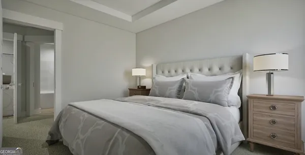 a bedroom with a bed and a night stand