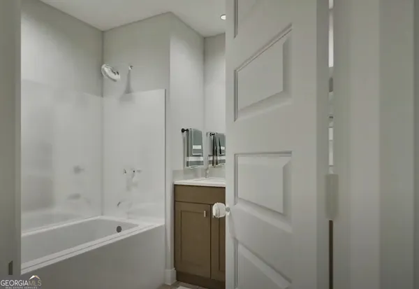 a bathroom with a bathtub sink and toilet