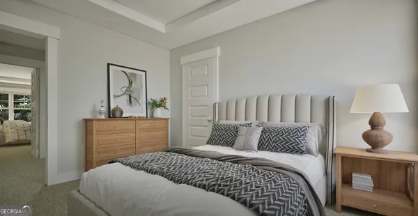 a bedroom with a bed and cabinet