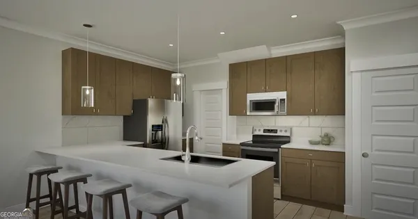 a kitchen with a sink cabinets and wooden floor