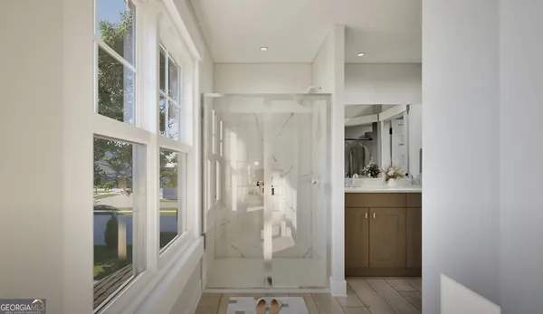 a bathroom with a shower and a sink