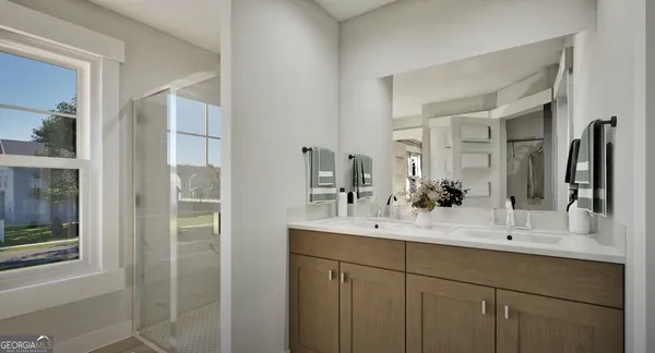 a bathroom with a double vanity sink mirror and double
