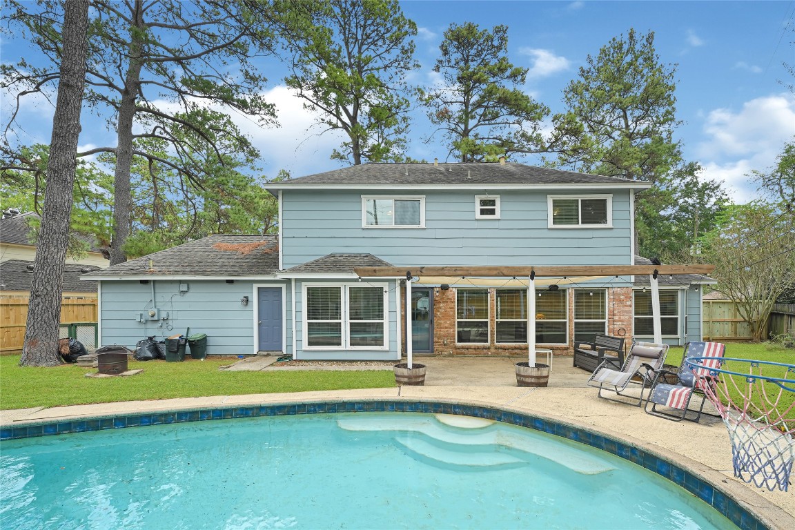 5322 Ashmere Lane Spring, TX 77379 - Photo 15 of 17 Spacious backyard featuring a sparkling pool—perfect for entertaining and relaxing all summer long.